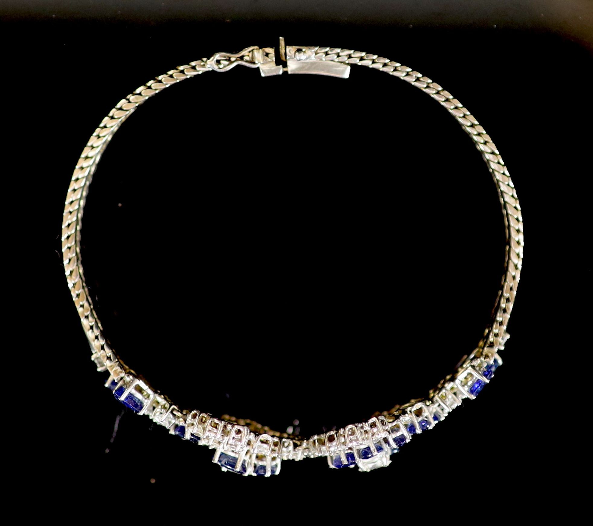 A 18ct white gold sapphire and diamond set double cluster bracelet